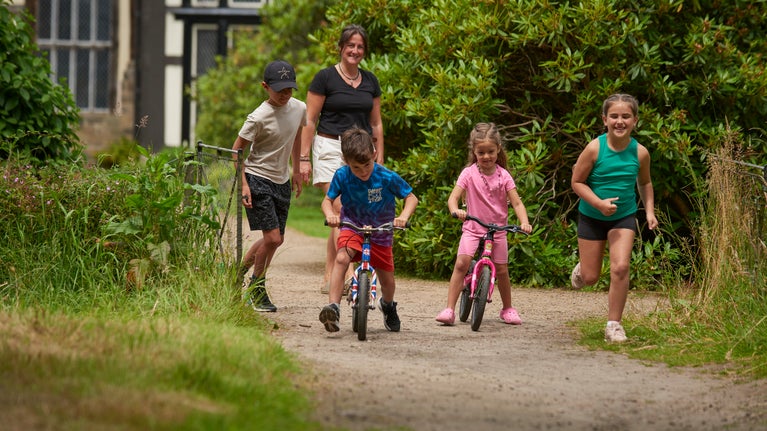 Children enjoying the balance bikes at Rufford Old Hall